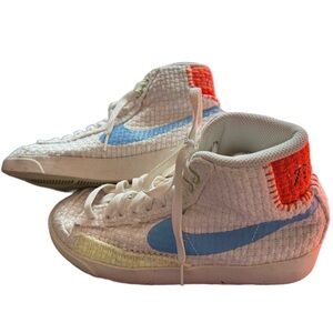 Nike Women’s White High-Top Sneakers with Blue Swoosh and Orange Heel Patch